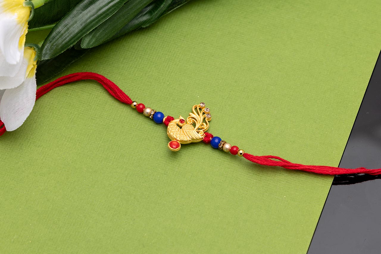 Alluring golden Mayur Rakhi