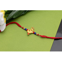 Alluring golden Mayur Rakhi