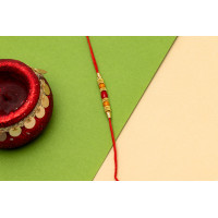 Golden red bead thread rakhi