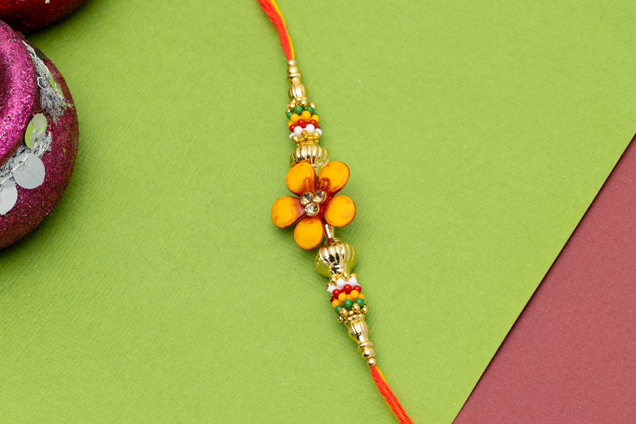 Alluring flower Thread Rakhi