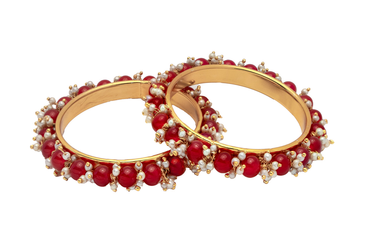 Pinkish red bead with golden base